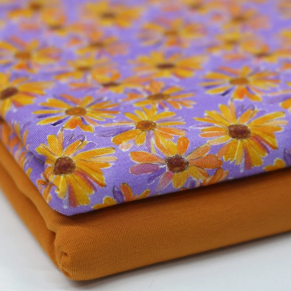 Digitale Print Bamboe Jersey - Madeliefje Bloem Lila Oranje Digitale Print Bamboe Jersey - Madeliefje Bloem Lila Oranje