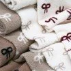 Curly Teddy Fabric Natural Beige with Bow Tie Print Curly Teddy Fabric Natural With Beige Bow Tie - (Curly Teddy Fabric)