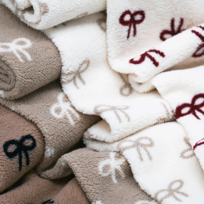 Curly Teddy Fabric Natural Beige with Bow Tie Print Curly Teddy Fabric Natural With Beige Bow Tie - (Curly Teddy Fabric)