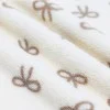 Tissu Fourrure Mouton Naturel Avec Nœud Papillon Beige