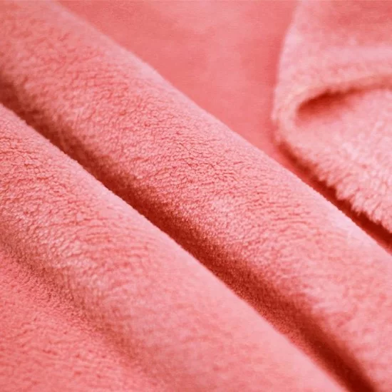Wellness fleece stof koral metervare